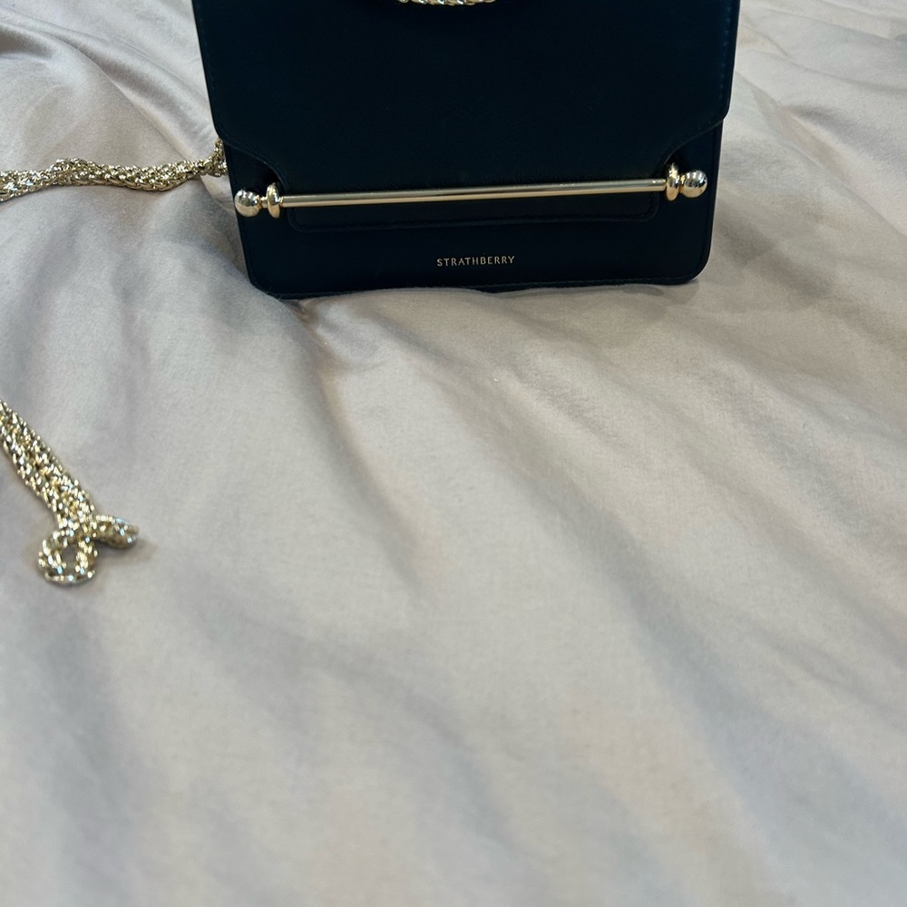 Strathberry Black and Gold Crossbody Bag with Sleek Design